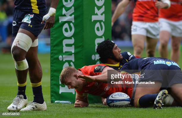 George Kruis of Saracens crashes over to score his team's second try during the European Rugby Champions Cup Final between ASM Clermont Auvergne and...