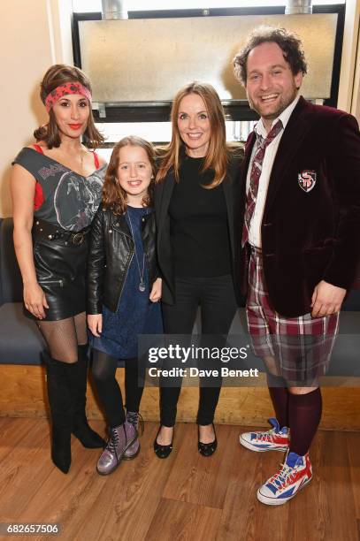 Geri Horner and daughter Bluebell Halliwell pose backstage with cast members Preeya Kalidas and Gary Trainor of the West End production of "School Of...