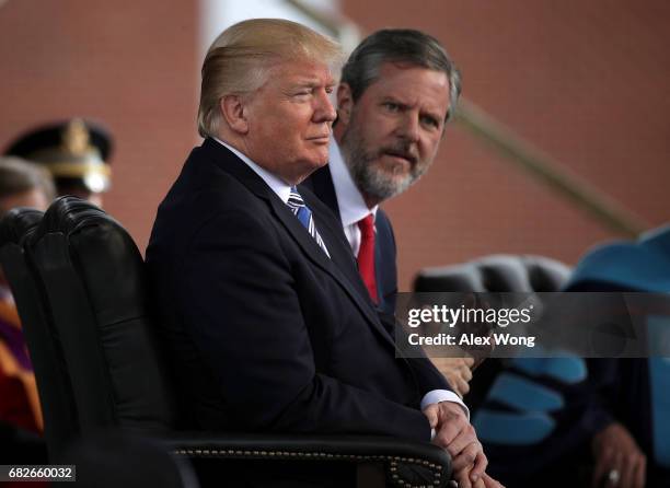 President Donald Trump and Jerry Falwell , President of Liberty University, on stage during a commencement at Liberty University May 13, 2017 in...