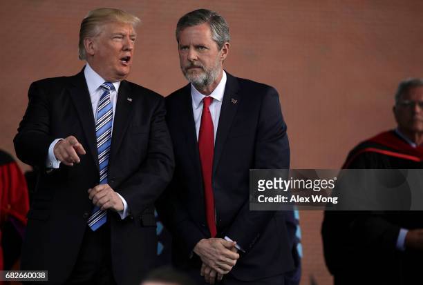 President Donald Trump and Jerry Falwell , President of Liberty University, on stage during a commencement at Liberty University May 13, 2017 in...