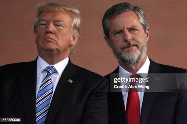 President Donald Trump and Jerry Falwell , President of Liberty University, on stage during a commencement at Liberty University May 13, 2017 in...