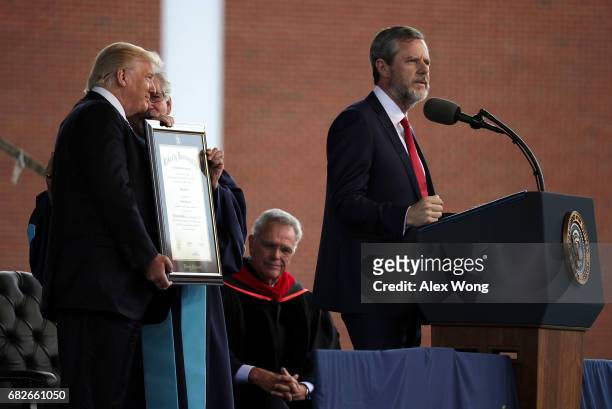 Jerry Falwell , President of Liberty University, speaks as U.S. President Donald Trump is presented with a Doctorate of Laws by Provost and Chief...