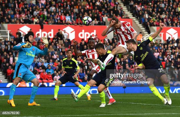 Peter Crouch of Stoke City scores his sides first goal past Petr Cech of Arsenal during the Premier League match between Stoke City and Arsenal at...