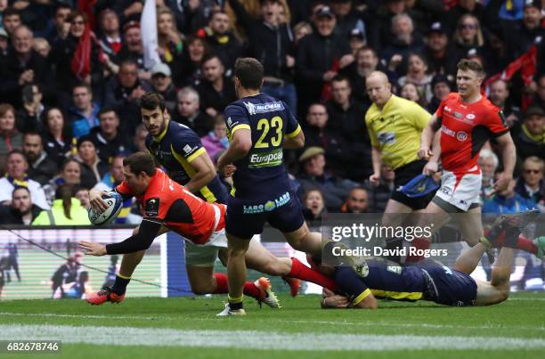 Alex Goode of Saracens dives over to score his team's third try during the European Rugby Champions Cup Final between ASM Clermont Auvergne and...