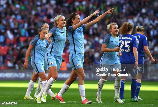 Jill Scott of Manchester City celebrates scoring her sides fourth goal with Isobel Christiansen of Manchester City and Steph Houghton of Manchester...