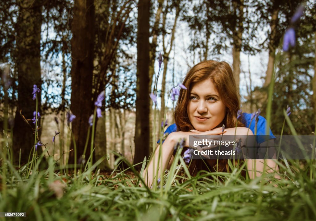 Beautiful young woman in the woods