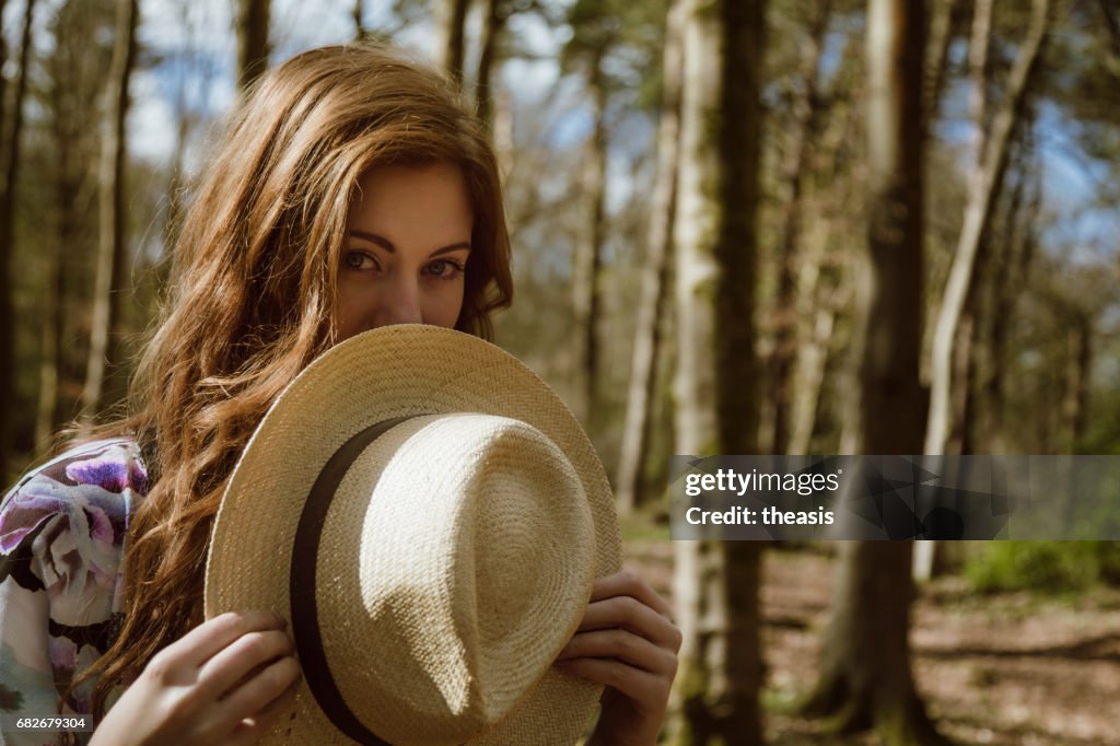 Beautiful young woman in the woods