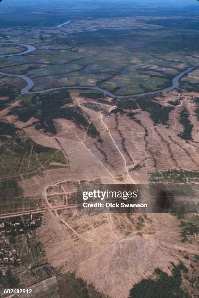 Arial view of a section of the Saigon River and the razed Iron Triangle village of Ben Suc, Vietnam, 1967. The village and surrounded fields were...