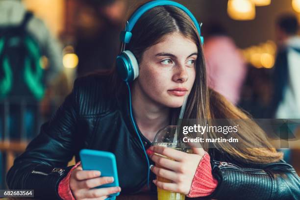 teenage girl studying foreign language - mp3 juices stock pictures, royalty-free photos & images