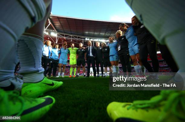 The Man City Ladies team and staff create a huddle to celebrate winning the cup after the SSE Women's FA Cup Final between Birmingham City Ladies and...