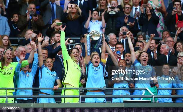 Steph Houghton of Manchester City lifts the trophy after the SSE Women's FA Cup Final between Birmingham City Ladies and Manchester City Women at...