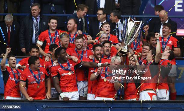 Saracens lift the trophy following their 28-17 victory during the European Rugby Champions Cup Final between ASM Clermont Auvergne and Saracens at...