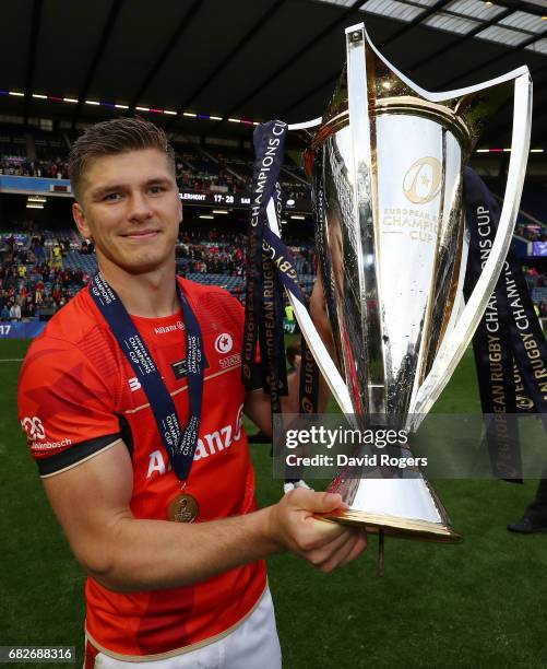 Owen Farrell of Saracens celebrates with the trophy following his team's 28-17 victory during the European Rugby Champions Cup Final between ASM...