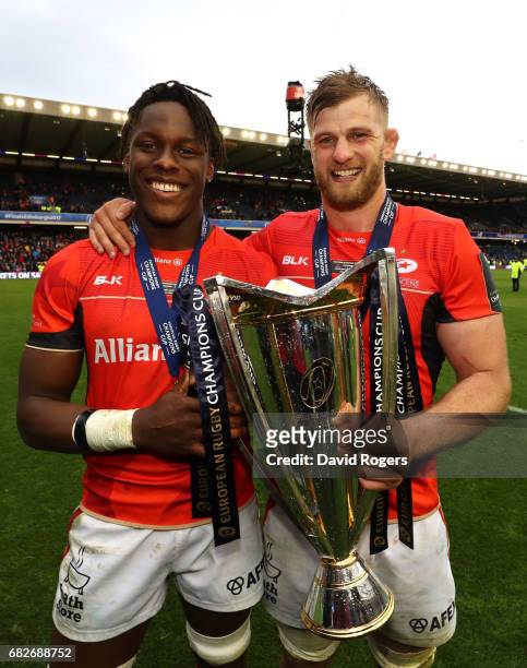 Maro Itoje and George Kruis of Saracens celebrate with the trophy following his team's 28-17 victory during the European Rugby Champions Cup Final...