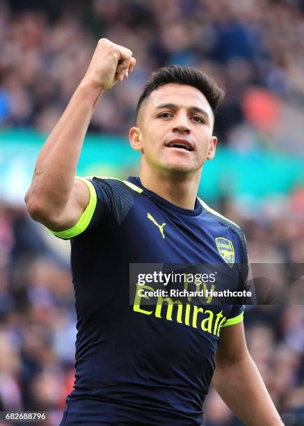 Alexis Sanchez of Arsenal celebrates scoring his sides third goal during the Premier League match between Stoke City and Arsenal at Bet365 Stadium on...