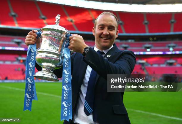 Nicholas Cushing, coach of Manchester City celebrates with the trophy after the SSE Women's FA Cup Final between Birmingham City Ladies and...