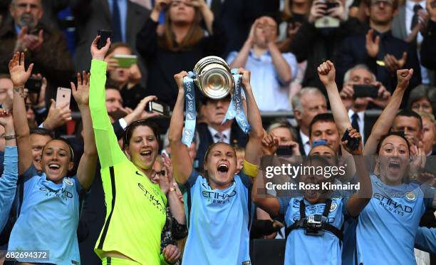 Steph Houghton of Manchester City lifts the trophy after the SSE Women's FA Cup Final between Birmingham City Ladies and Manchester City Women at...