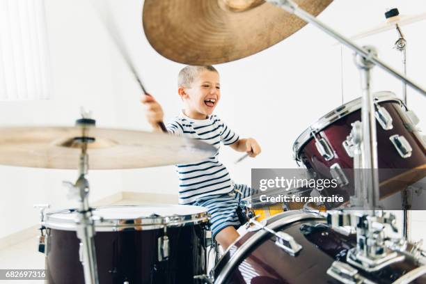 little boy playing drums - playing drums stock pictures, royalty-free photos & images