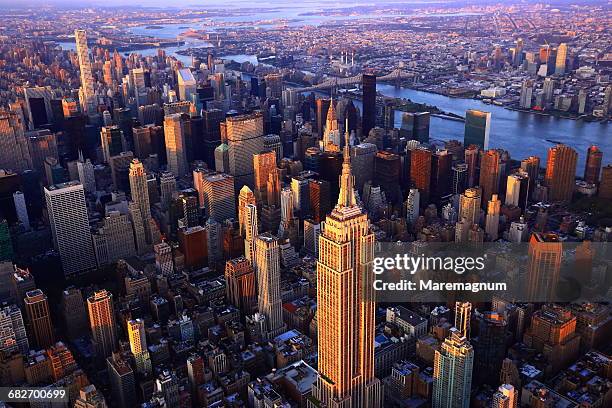 manhattan from above by helicopter - midtown manhattan stock-fotos und bilder