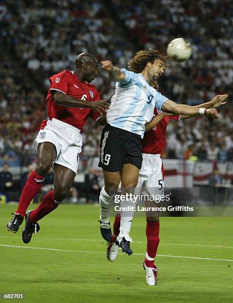 Gabriel Batistuta of Argentina wins the ball in the air against Sol Campbell and Rio Ferdinand of England during the FIFA World Cup Finals 2002 Group...