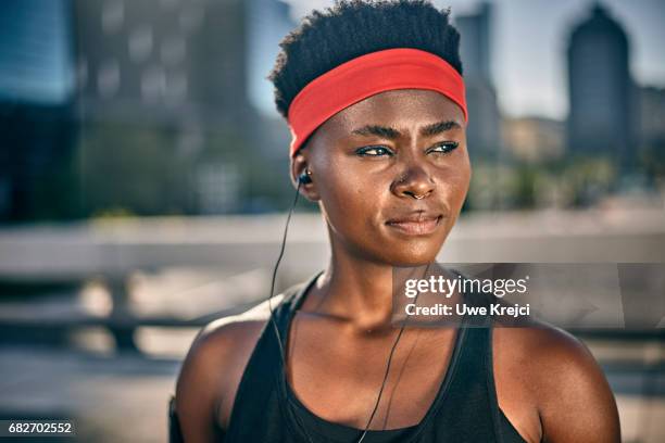 portrait of young female runner - sweat band stock pictures, royalty-free photos & images