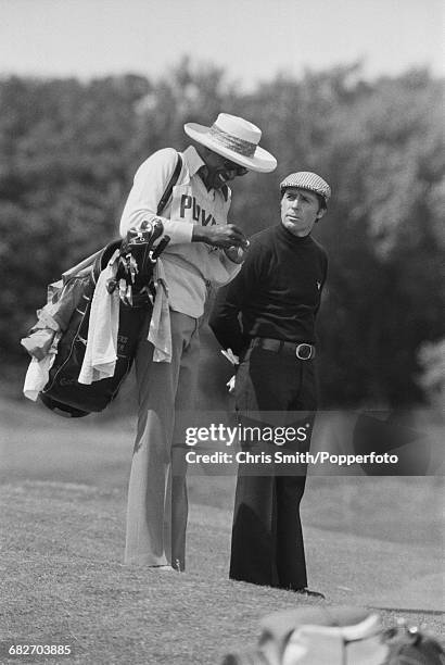 South African golfer Gary Player pictured with his caddy Alfred 'Rabbit' Dyer during action to win the 1974 Open Championship at Royal Lytham & St...