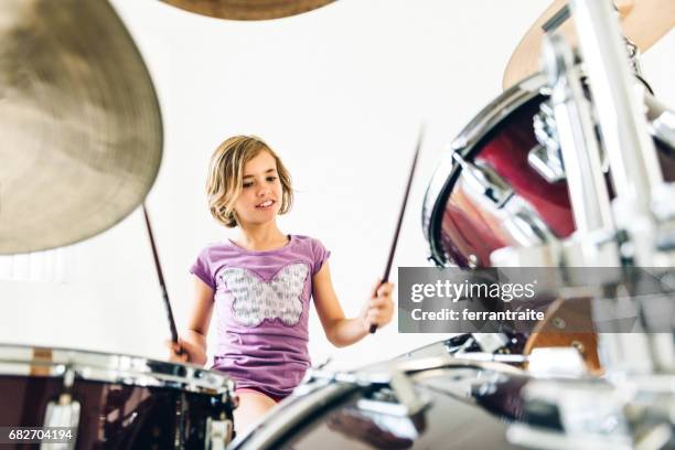 little girl playing drums - hitting drum stock pictures, royalty-free photos & images