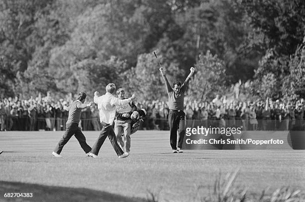 Scottish golfer Sam Torrance raises his arms in the air in celebration during play for Team Europe to win the 1985 Ryder Cup 16.5 - 11.5 against Team...