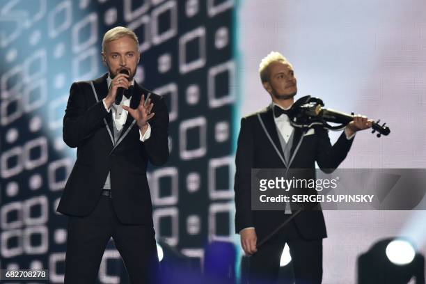 Sergei Yalovitsky singer of the Moldavian musical trio representing Moldavia with the song "Hey Mamma!" SunStroke Project performs on stage during...