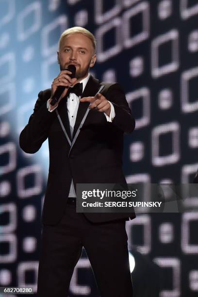 Sergei Yalovitsky singer of the Moldavian musical trio representing Moldavia with the song "Hey Mamma!" SunStroke Project performs on stage during...