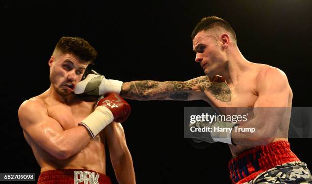 Josh Kelly and Jony Vina exchange punches during the Welterweight Contest between Josh Kelly and Jony Vina at the Barclaycard Arena on May 13, 2017...