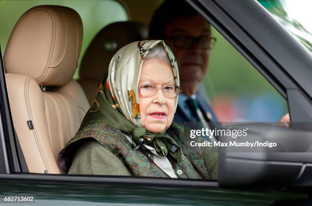 Queen Elizabeth II drives her Range Rover car as she attends day 4 of the Royal Windsor Horse Show in Home Park on May 13, 2017 in Windsor, England.