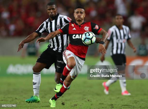 Everton of Flamengo struggles for the ball with Carlos Csar of Atletico MG during a match between Flamengo and Atletico MG part of Brasileirao Series...