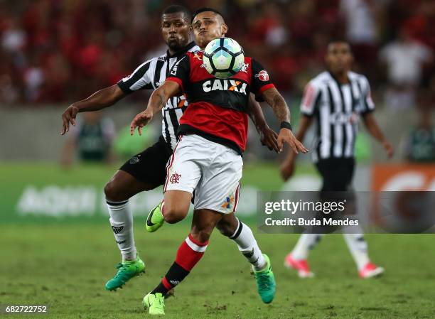Everton of Flamengo struggles for the ball with Carlos Csar of Atletico MG during a match between Flamengo and Atletico MG part of Brasileirao Series...