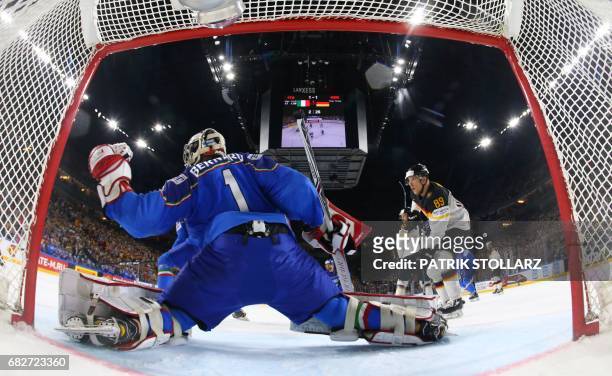 Italy´s Andreas Bernard and Germany´s David Wolf vie during the IIHF Ice Hockey World Championships first round match between Italy and Germany in...