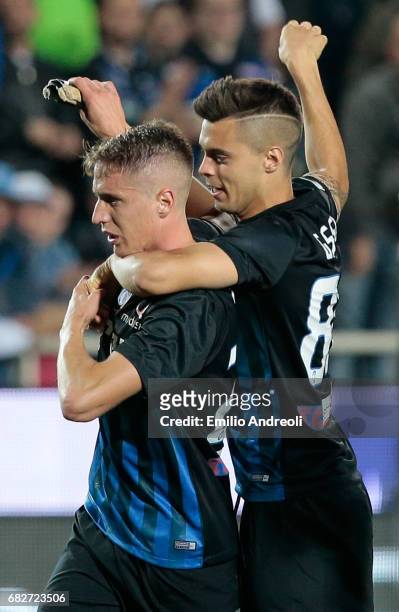 Andrea Conti of Atalanta BC celebrates the qualification at UEFA Europa League 2017/18 with his team-mate Alberto Grassi at the end of theduring the...