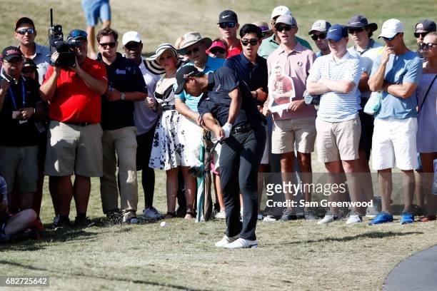 Si Woo Kim of Korea plays a shot on the 14th hole during the third round of THE PLAYERS Championship at the Stadium course at TPC Sawgrass on May 13,...