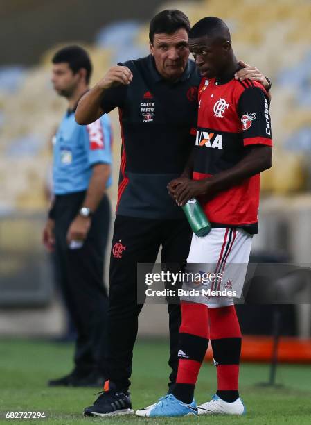Vinicius Jr. Of Flamengo speaks with the head coach Ze Ricardo during a match between Flamengo and Atletico MG part of Brasileirao Series A 2017 at...
