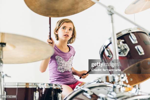 little girl playing drums - hitting drum stock pictures, royalty-free photos & images