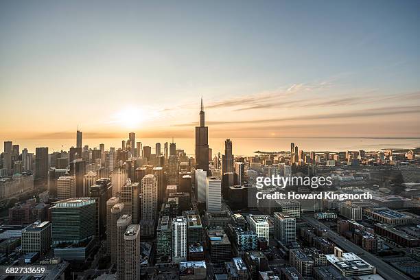 aerial shot of chicago waterfront at sunrise - illinois stock-fotos und bilder
