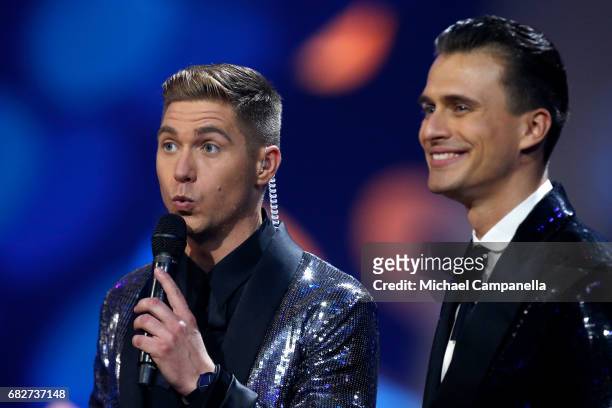 Presenters Oleksandr Skichko and Volodymyr Ostapchuk speak on stage during the final of the 62nd Eurovision Song Contest at International Exhibition...