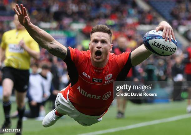 Chris Ashton of Saracens dives over for their first try during the European Rugby Champions Cup Final between ASM Clermont Auvergen and Saracens at...