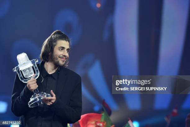 Portuguese singer representing Portugal with the song "Amar Pelos Dios" Salvador Vilar Braamcamp Sobral aka Salvador Sobral holds the trophy as he...