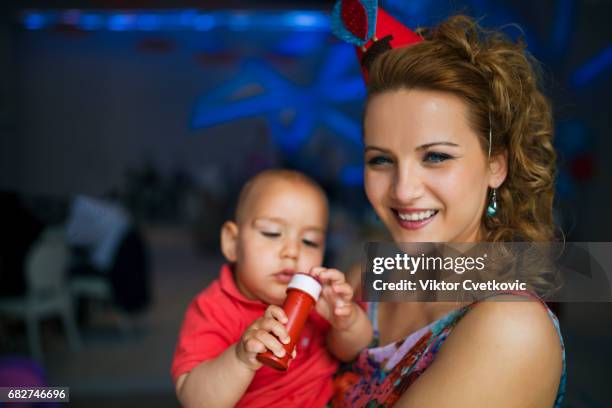 celebrating birthday party - 1 year anniversary stock pictures, royalty-free photos & images