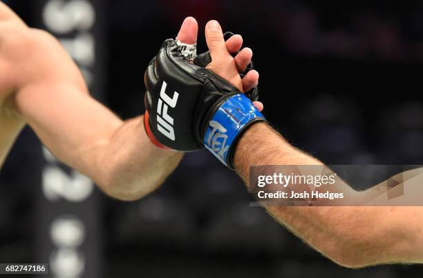 Joachim Christensen touches gloves with Gadzhimurad Antigulov in their light heavyweight fight during the UFC 211 event at the American Airlines...