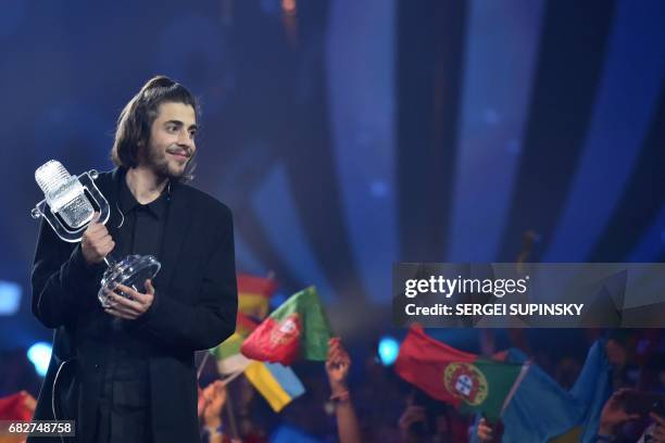 Portuguese singer representing Portugal with the song "Amar Pelos Dios" Salvador Vilar Braamcamp Sobral aka Salvador Sobral holds the trophy as he...