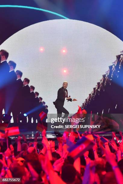 Singer Sergei Yalovitsky of the Moldavian musical trio representing Moldavia with the song "Hey Mamma!" SunStroke Project performs on stage during...