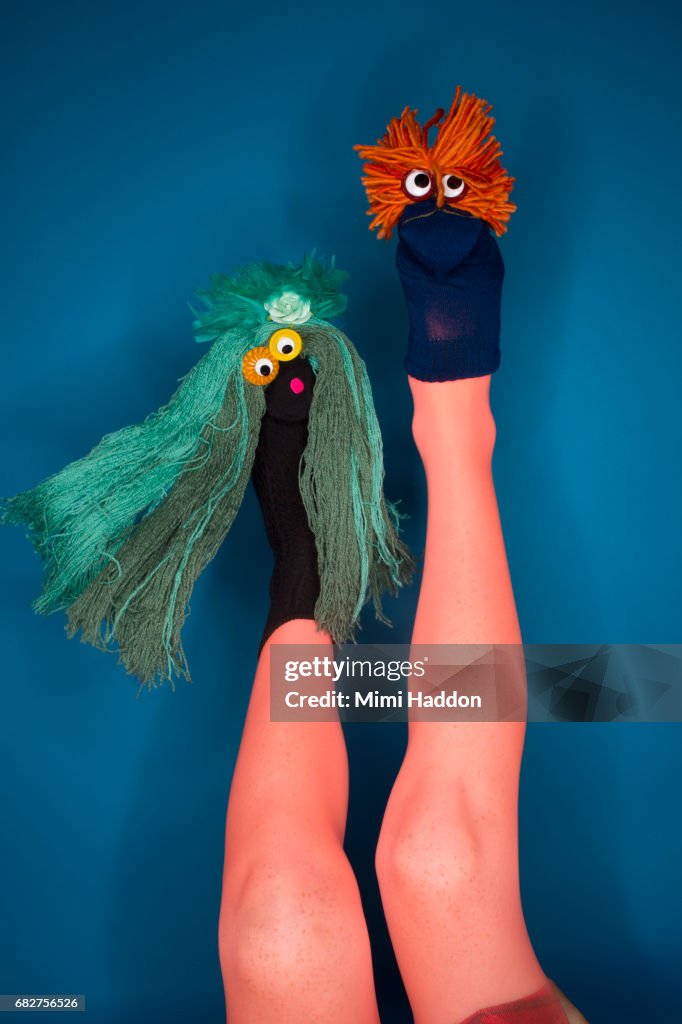 Person Doing Sock Puppet Show with Feet