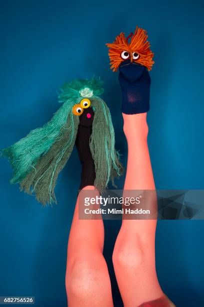 person doing sock puppet show with feet - leg show stock pictures, royalty-free photos & images