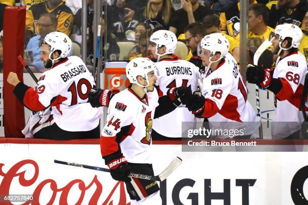 Jean-Gabriel Pageau of the Ottawa Senators celebrates with his teammates after scoring a goal against Marc-Andre Fleury of the Pittsburgh Penguins...